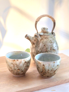 Tea set with teapot in ash glaze and gas fired wood assisted stoneware with two small cups